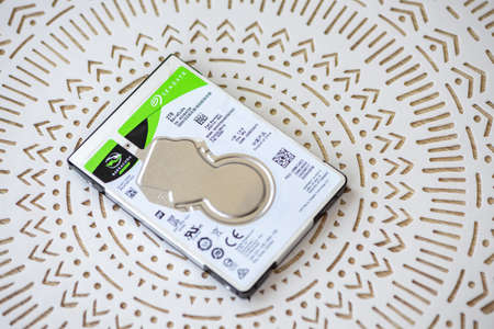 Timisoara, Romania - July 18, 2021: Close-up of a Seagate BarraCuda ST2000LM015 2TB 2.5'' hard disk...