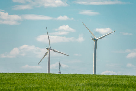 Wind turbine on a filed, wind farm generating electrical energyの写真素材