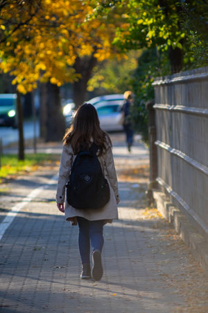 Woman walking on the street. Real people.の写真素材