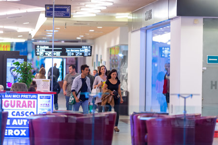 Timisoara, Romania - September 24, 2013: People walking inside a mall looking for shopping. Real people.のeditorial素材