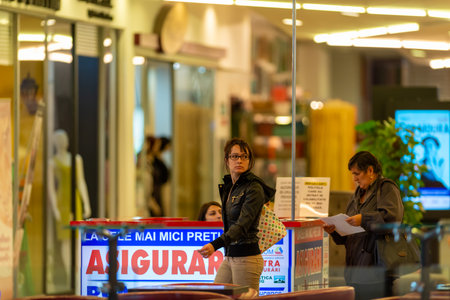 Timisoara, Romania - September 24, 2013: People walking inside a mall looking for shopping. Real people.のeditorial素材