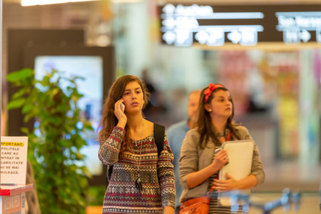 Timisoara, Romania - September 24, 2013: People walking inside a mall looking for shopping. Real people.のeditorial素材