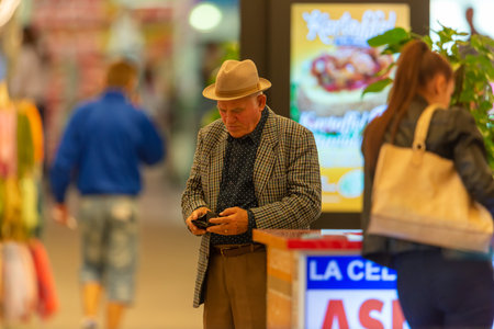 Timisoara, Romania - September 24, 2013: People walking inside a mall looking for shopping. Real people.のeditorial素材