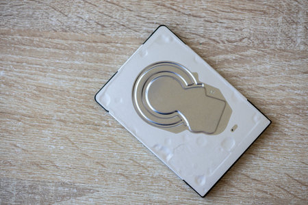 Close-up of a hard disk isolated on a table. Front view.の写真素材