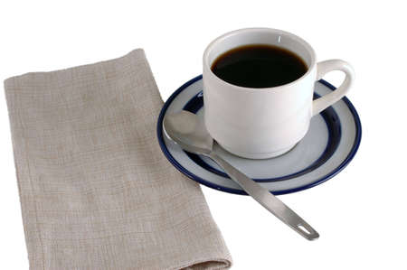 Coffee cup with saucer, blue and white, napkin and spoon,  isolatedの写真素材