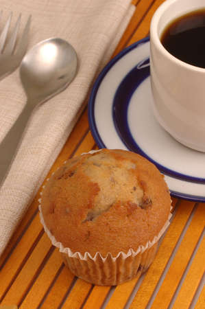 Coffee cup and saucer on wood slat place-matの写真素材