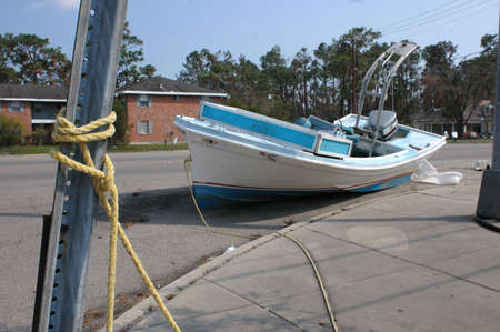 A fishing boat docked on a major street in Slidell after Hurricane Katrinaの写真素材