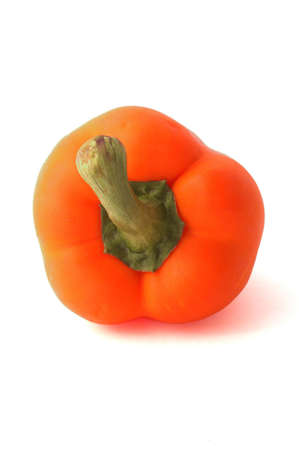 A fresh orange bell pepper over whiteの写真素材