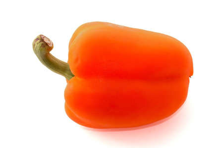 A fresh orange bell pepper over whiteの写真素材