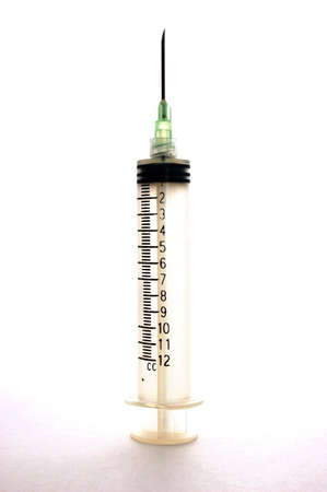 A very large capacity syringe over whiteの写真素材