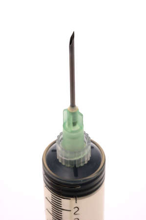 A very large capacity syringe over white, close-up of needle tip, focus falls off softly.の写真素材