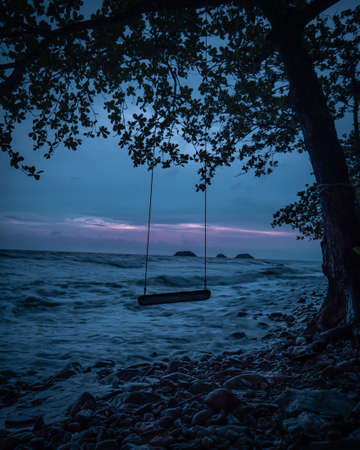 A swing on the beach at night in Koh Chang Island