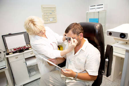 Doctor,examining a patient in ophthalmology clinic
