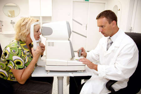 Doctor,examining a patient in ophthalmology clinic