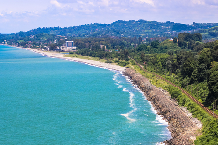 BATUMI, GEORGIA-JULY 9 2015 Beautiful Scenic Summer View From Botanical Garden Of Sea Bay And Railroad On Coast. The Lush Green Vegetation Of Summer. Sunny Day.のeditorial素材