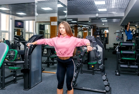 GRODNO, BELARUS - OCTOBER 24, 2017.Beautiful girl is engaged in a gym