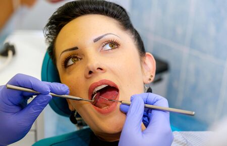 GRODNO, BELARUS-OCTOBER 13,2017. Teeth whitening with UV lamp with photopolymer composition.のeditorial素材