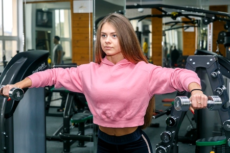 Beautiful girl is engaged in a gymの写真素材