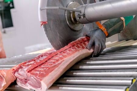 cutting beef at a meat factory.の写真素材