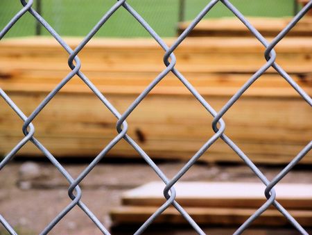 Chain Link Fence Protecting Lumberyardの写真素材