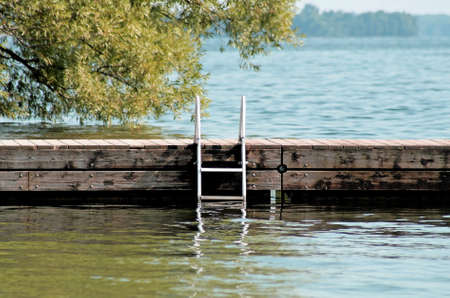 Swimming Dock With Ladder At Beautiful Lakeの写真素材