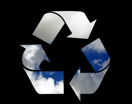 Recycle symbol using clouds - isolated on black の写真素材