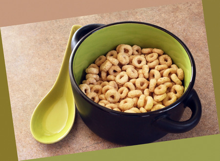 Bowl of cheerios breakfast cereal without milk