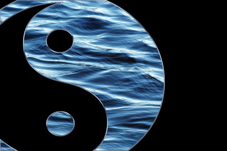 Blue water Yin Yang symbol isolated on a black backgroundの写真素材