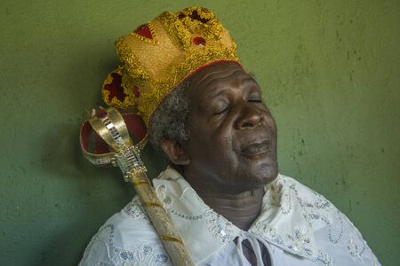 GonÃ§alves, Minas Gerais, Brazil - March 19, 2016: Afro-Brazilian man in costume, celebrating the Revelry of Kings during carnivalのeditorial素材