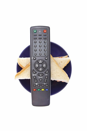 new universal remote control with sandwiches on white backgroundの写真素材