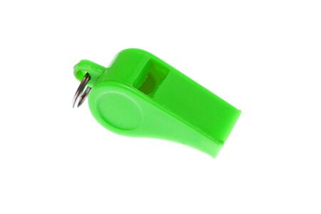 light green plastic whistle on white backgroundの写真素材