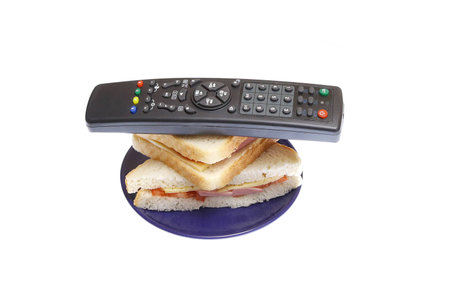 new universal remote control with sandwiches on white background