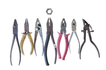group of vintage pliers teamwork turning nut on white background