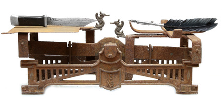 pen is mightier than sword proverb representing vintage scales with pen in one cup and sword in otherの写真素材