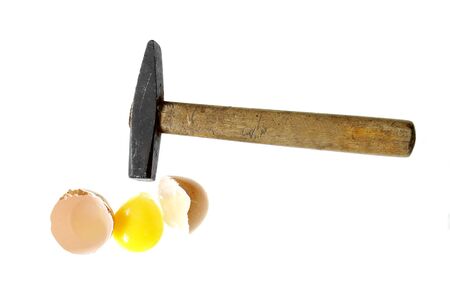 you can"t make an omlet without braking a few eggs proverb hammer broken egg isolated on white backgroundの写真素材