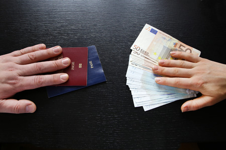 buying illegal foreign passport hands exchanging money and documents buyer seller