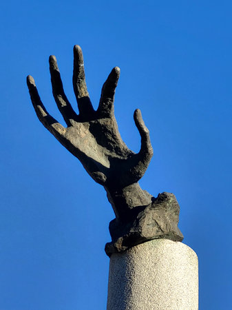 hand on sky background looking man blue statue clearの写真素材