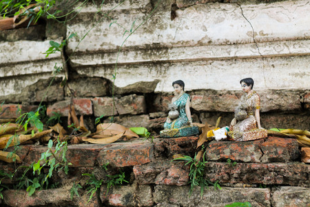 View of behind temple, old building and old woman dollの写真素材