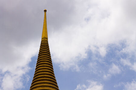 Golden pagoda with blue sky backgroundの写真素材