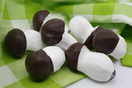 Homemade mushroom-shaped cookies on a checkered kitchen towel. Sweet biscuits mushroomsの写真素材