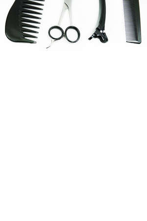 Hairdresser tools isolated on white background with copy space for your text. Scissor, comb and hairpins.の写真素材