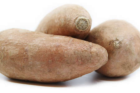Organic sweet potatoes isolated on a white background. Healthy eatingの写真素材
