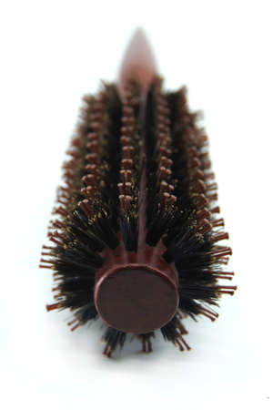 Round wooden hair brush on the white background. Closeupの写真素材
