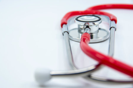 Red stethoscope on white background. Medical devices For treatment. Healthcare concept. Copy space for your textの写真素材
