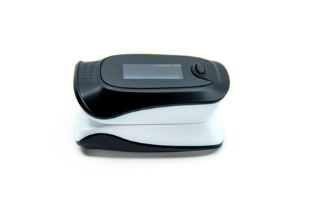 Pulse oximeter isolated on white background. Pulse oximeter used to measure pulse rate and oxygen levels.の写真素材