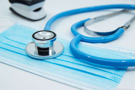 Stethoscope, Pulse Oximeter and medical face mask isolated on white background.の写真素材