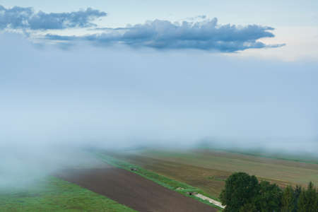 Wonderful autumn morning on the mound of Seredge. View of the Nemunas River drowned in fog.の写真素材