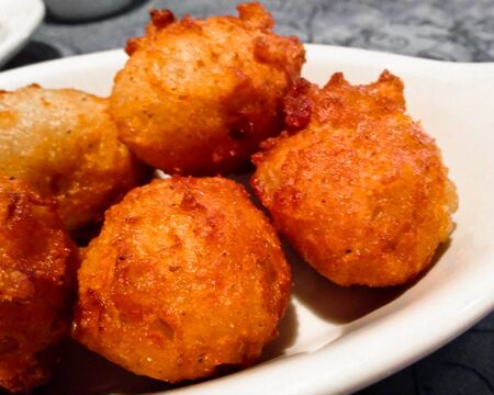 Hushpuppies are made of cornmeal. A typical Southern side dish.
