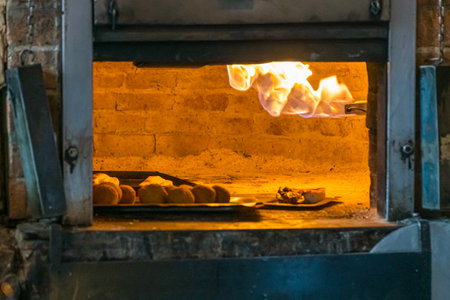 Baked bread in a brick oven in the kitchen of a restaurant in the city of Buenos Aires, Argentina