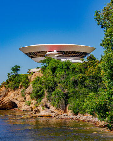 NiterÃ³i, Rio de Janeiro, Brazil - CIRCA 2021: The Museum of Contemporary Art in NiterÃ³i was designed by Oscar Niemeyer. Voted one of the 10 most influential works of architecture in the last 50 yearsのeditorial素材